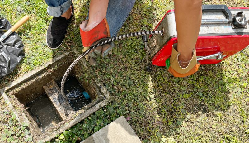 Drain cleaning in progress